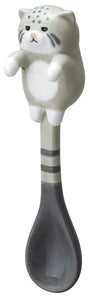 Grey cat hanging spoon