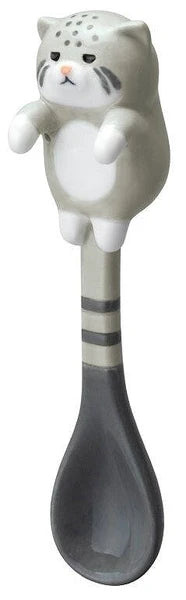 Grey cat hanging spoon